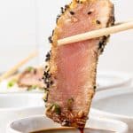 Seared Ahi Tuna dipping into soy sauce