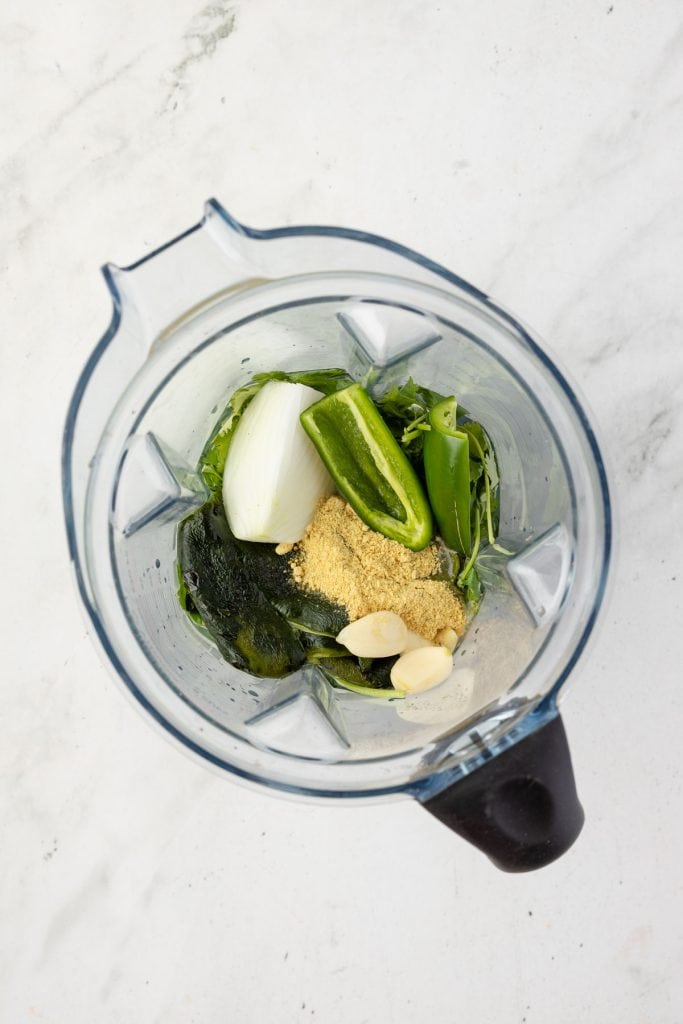 Peppers, onion, chicken bouillon, cilantro in a blender.