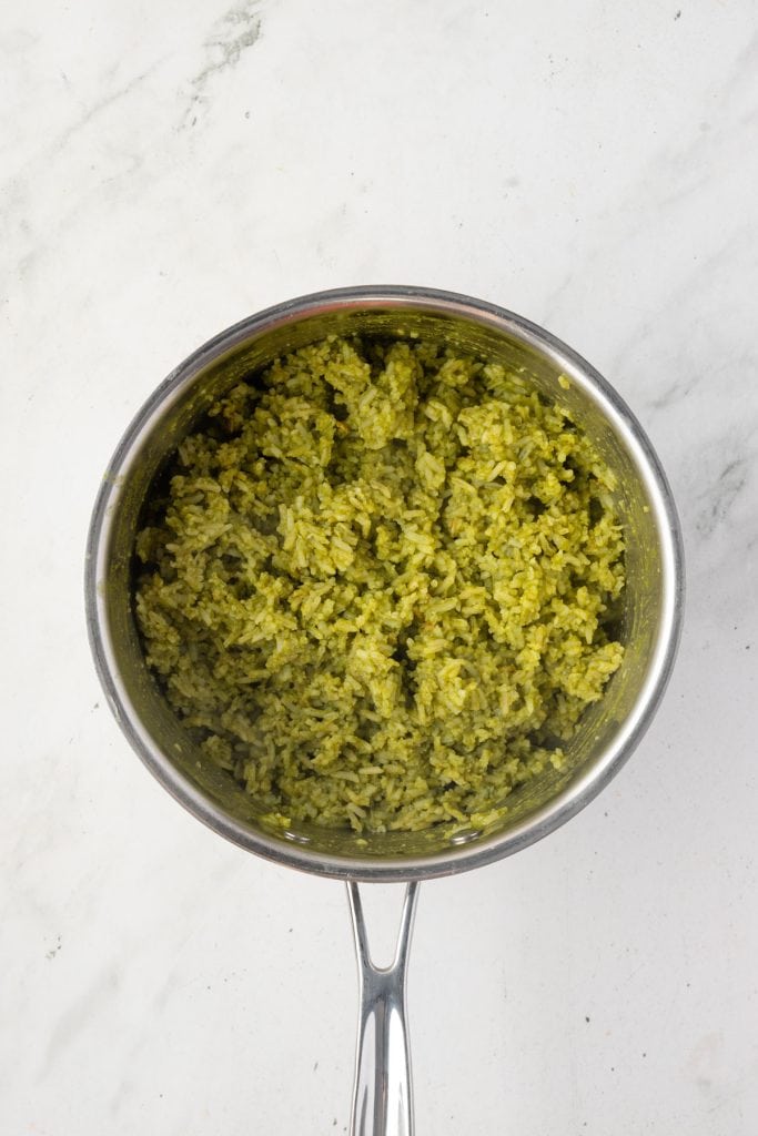 Finished green rice in a pot.