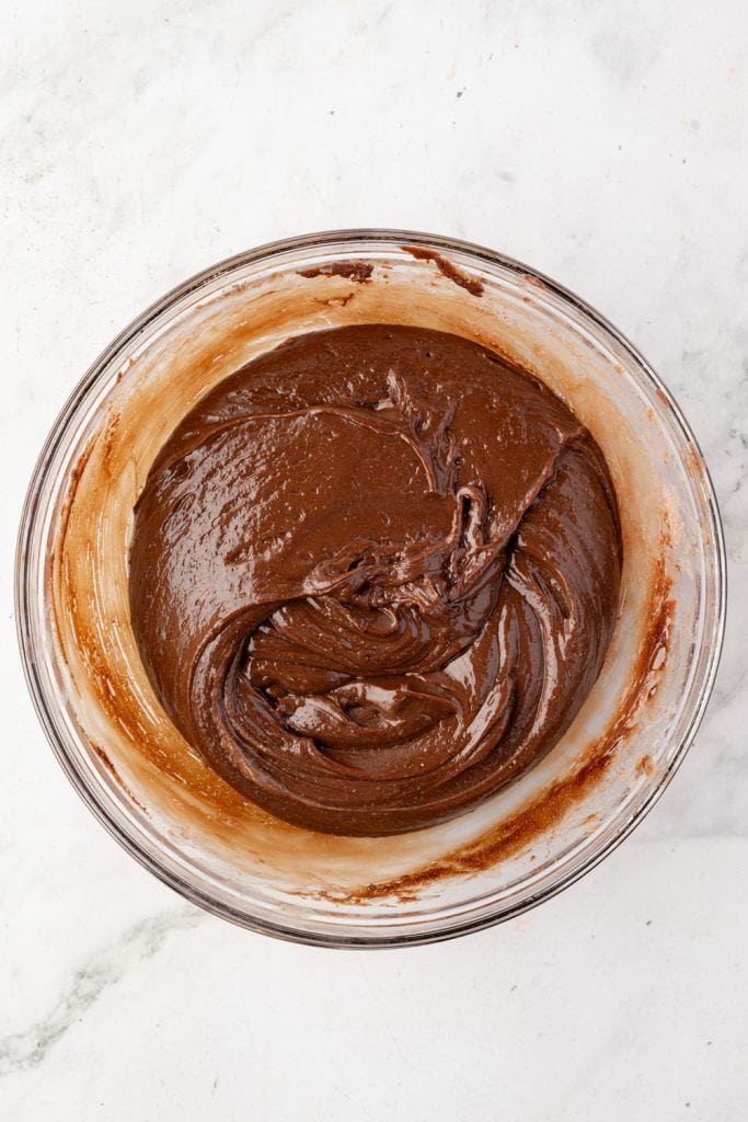 Melted, sweetened condensed milk, chocolate chips, butter, and hot cho
Melted, sweetened condensed milk, chocolate chips, butter, and hot chocolate mix in a mixing bowlcolate mix in a mixing bowl