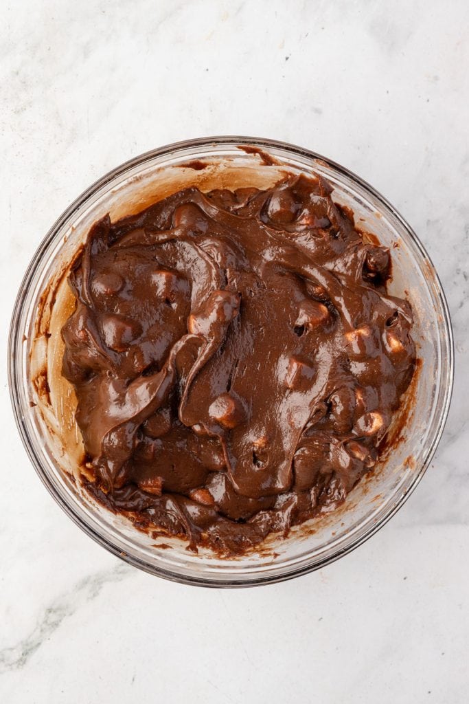 Hot chocolate fudge in a mixing bowl before pouring into a pan