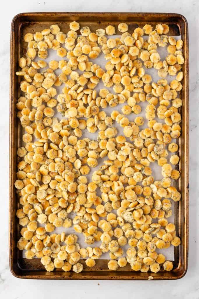 Ranch dill oyster crackers on a sheet panel before getting baked
