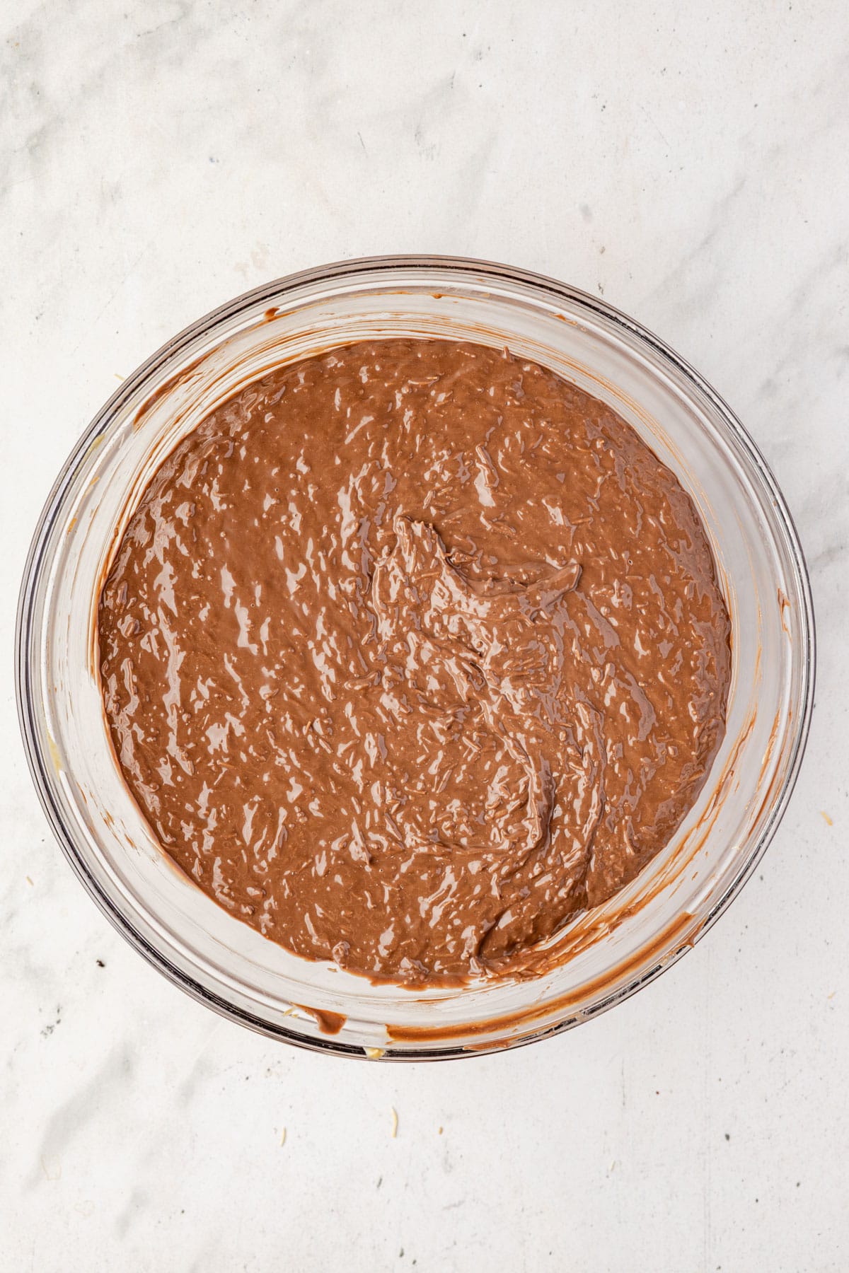 Melted Dubai chocolate bark in a mixing bowl.