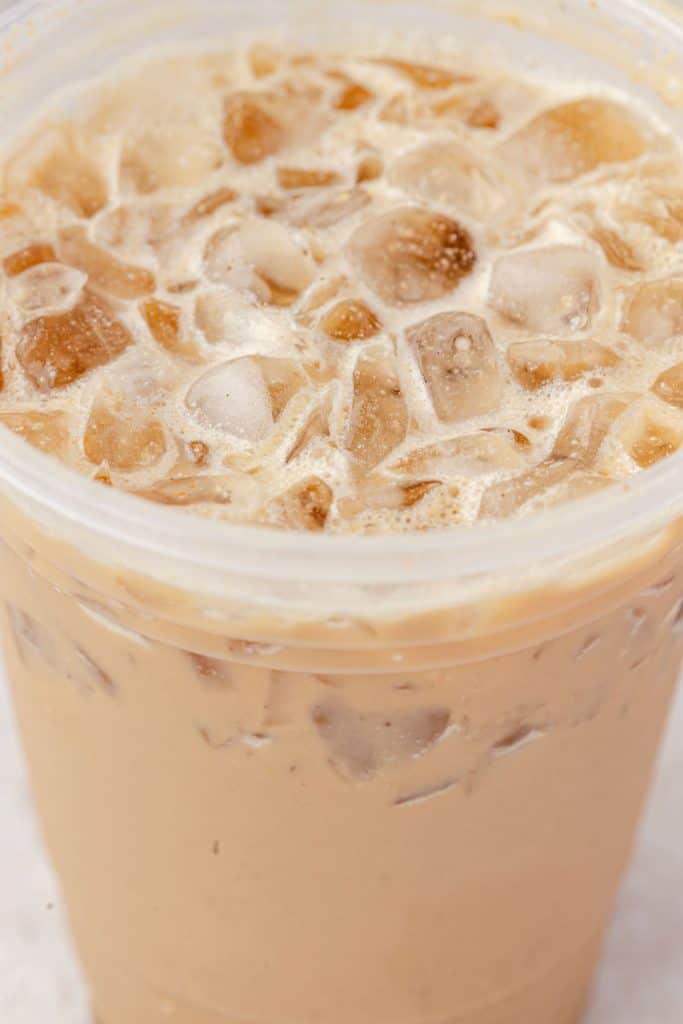 Up close image of pumpkin latte in a cup