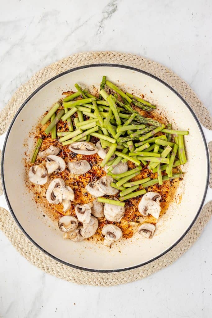 asparagus and mushrooms in a pan