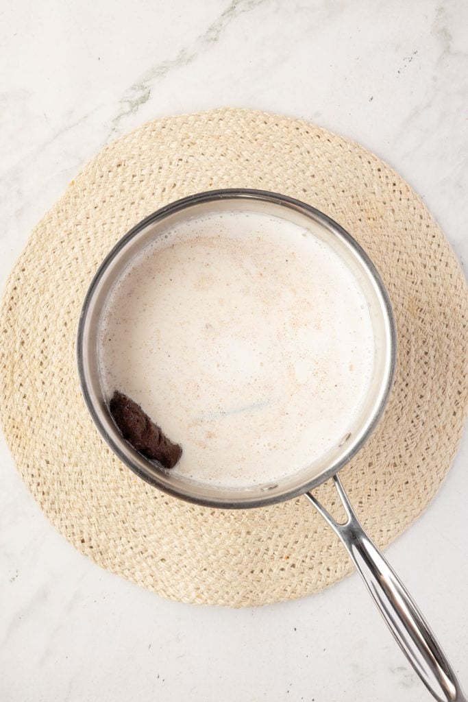 All of the ingredients for Mexican hot chocolate in a pot