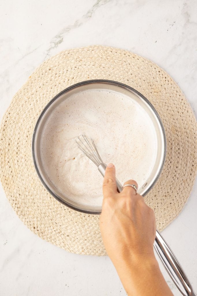 Whisking Mexican hot chocolate in a pot