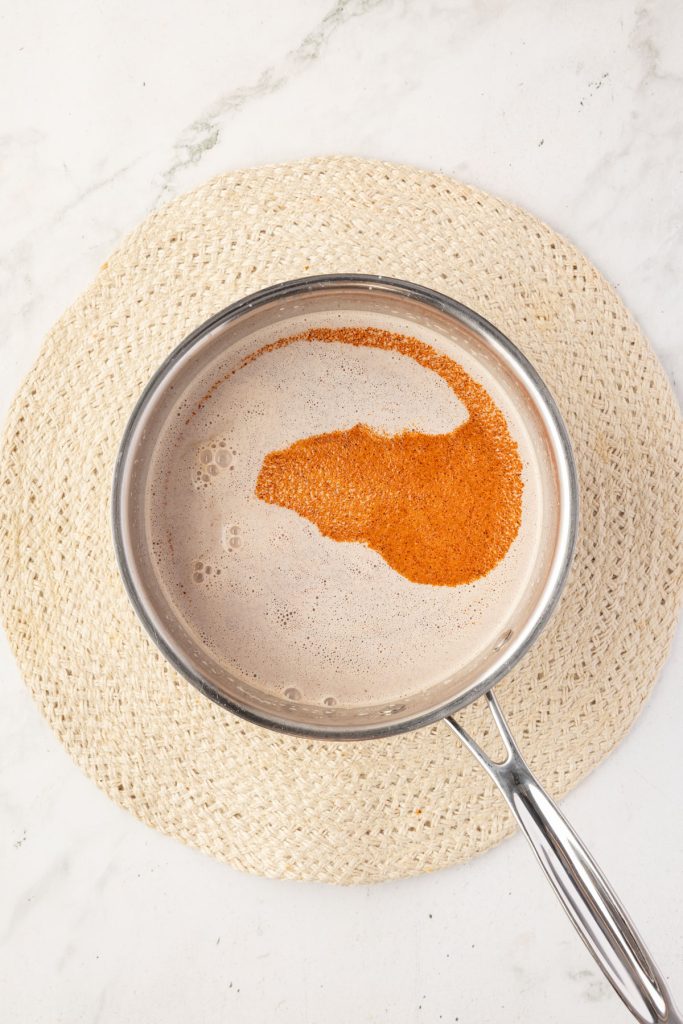 Milk, spices, and chocolate in a pot