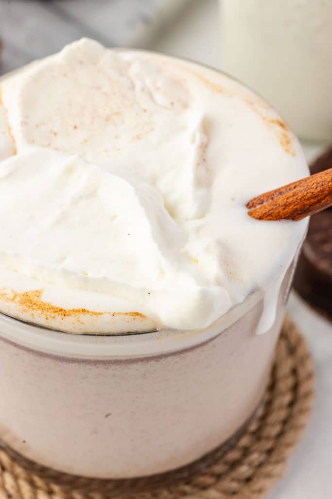 Mexican Hot ChocolateWeb045 Close-up shot of Mexican hot chocolate in a cup with whipped cream, spilling over the edge.