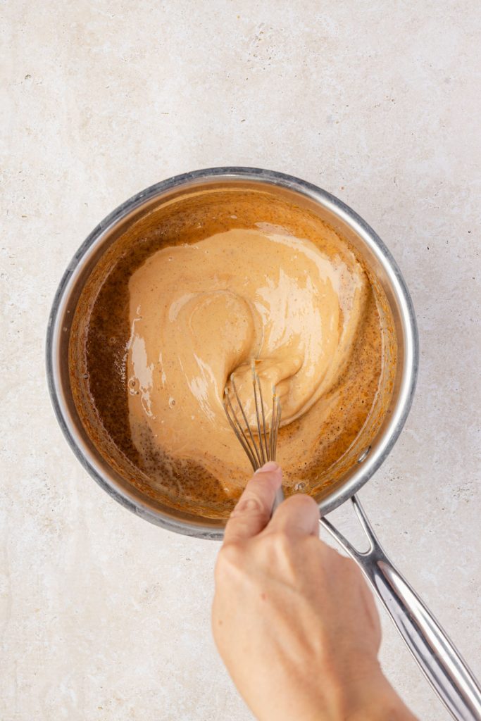 Whisking the ingredients together for pumpkin sauce syrup
