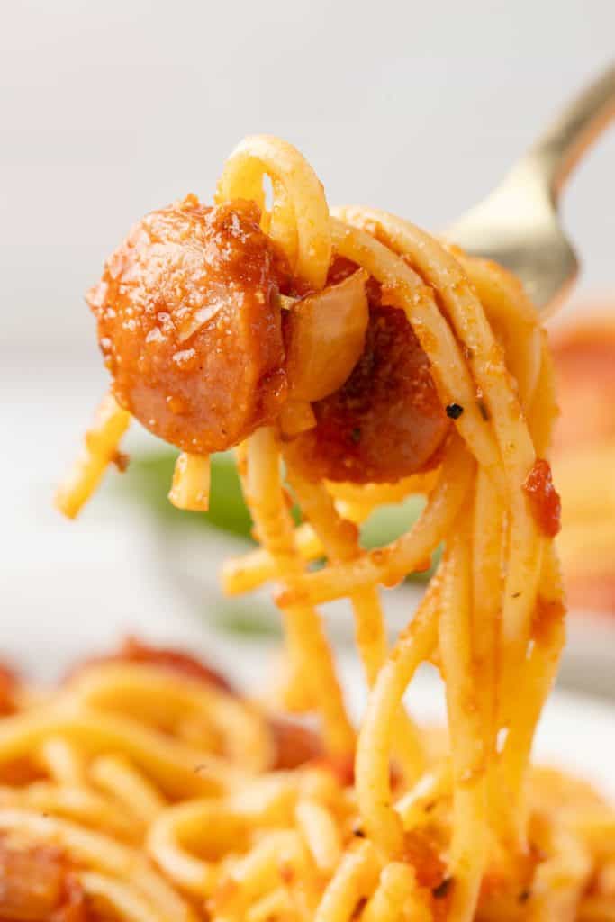 Spaghetti and Hot DogsWeb051 Hot dogs and spaghetti on a fork.