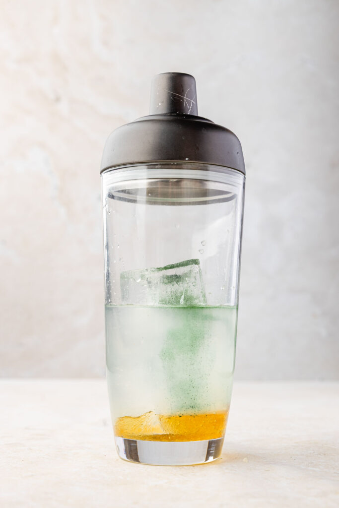 Ingredients for a champagne margarita in a cocktail shaker