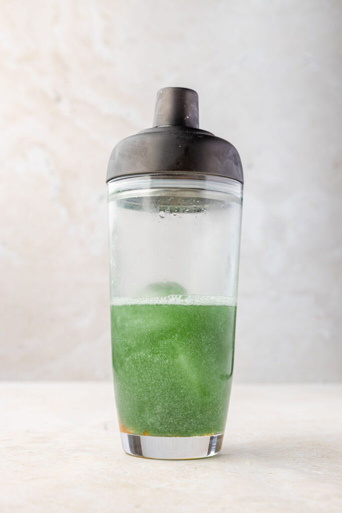 Sparkly green margarita in a cocktail shaker
