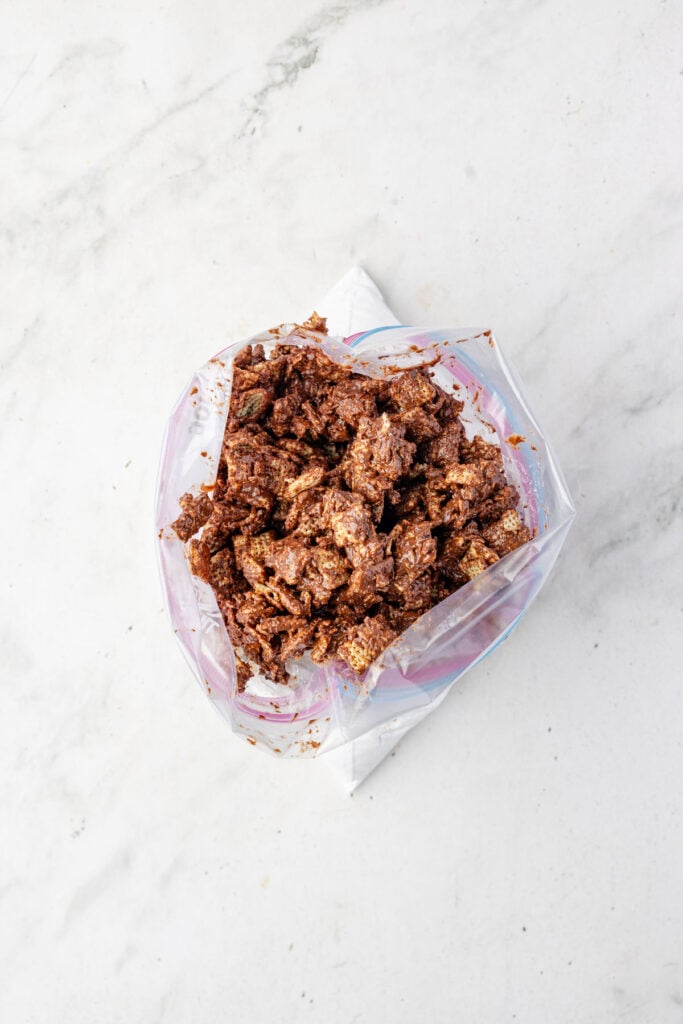 Puppy chow in a Ziploc bag with powdered sugar