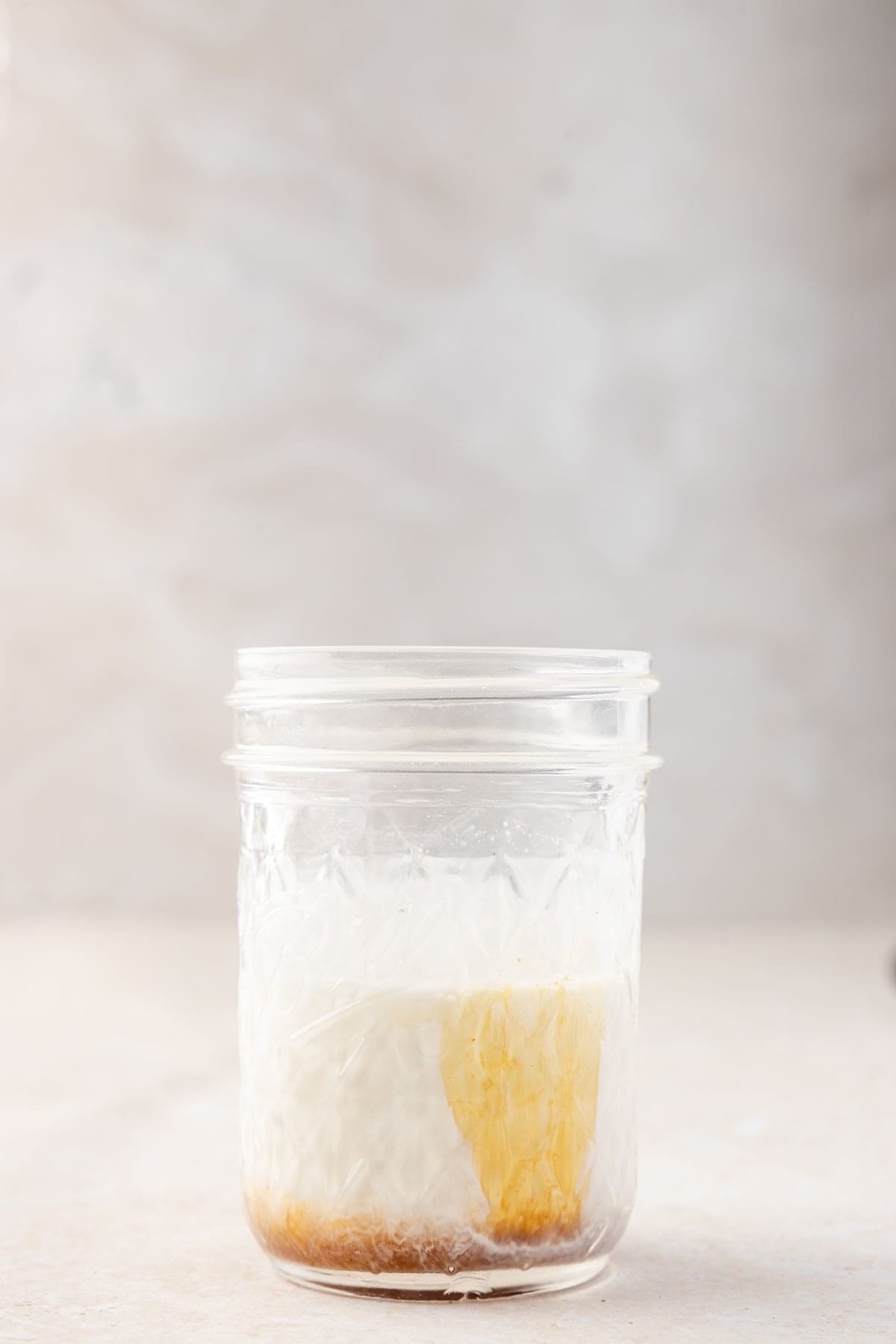 Oat milk and gingerbread syrup in a cup