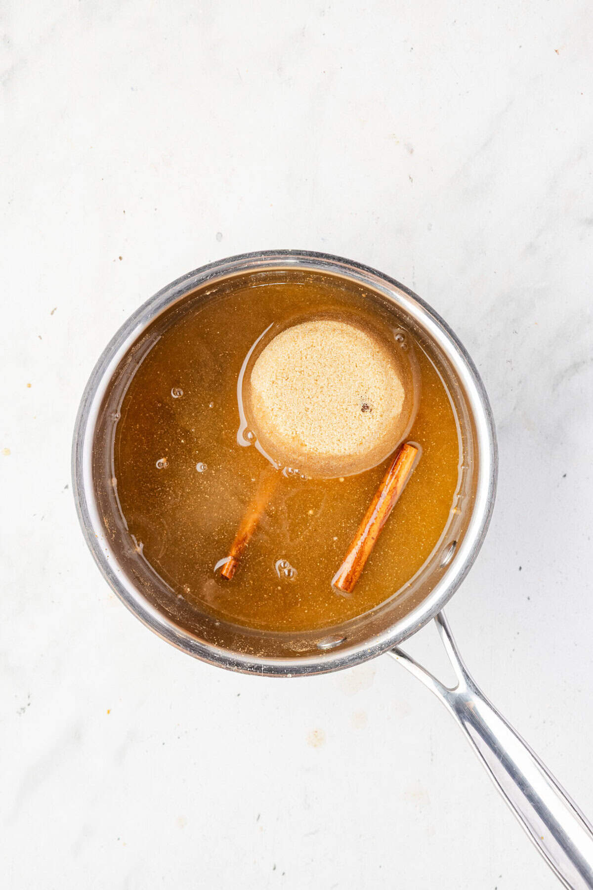 Water, brown sugar, molasses, spices in a pot