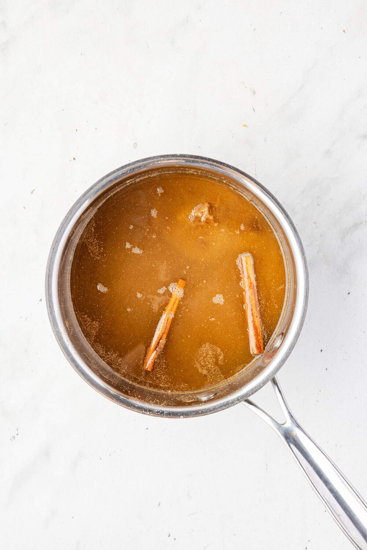 Water, brown sugar, molasses, spices in a pot