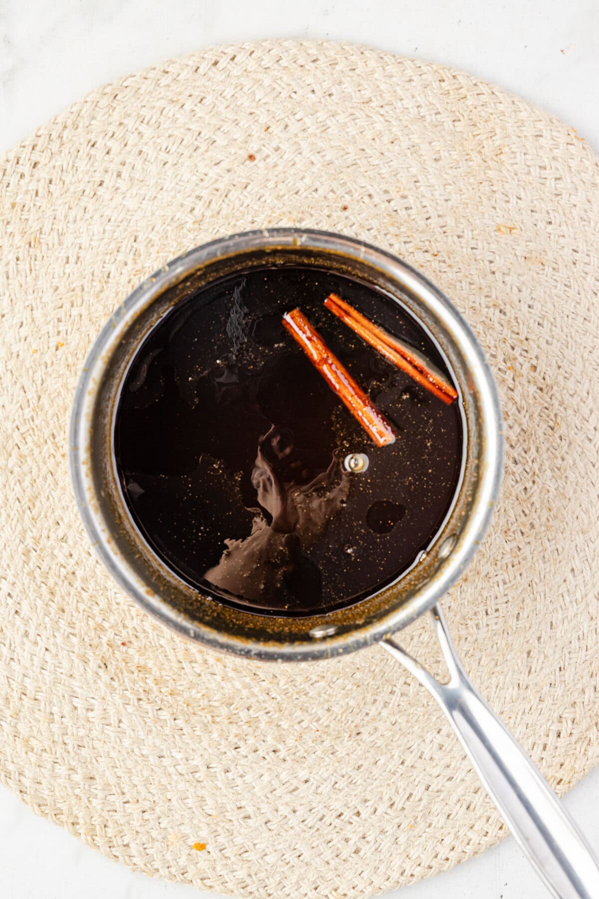 Water, brown sugar, molasses, spices cooked in a pot