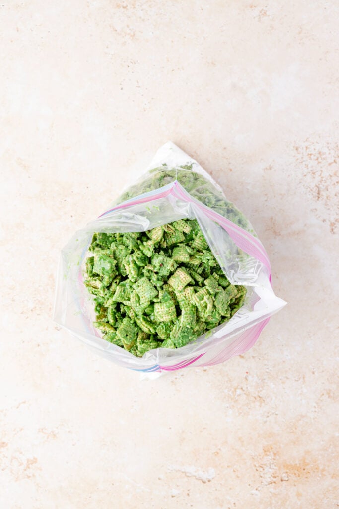 Green chocolate covered chex in a bag.