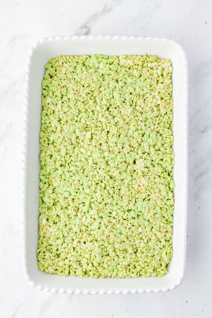 Green rice crispy treats in a casserole pan
