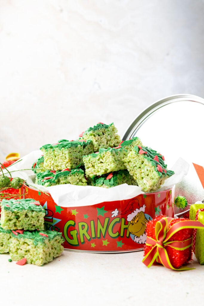 Grinch rice crispy treats in a metal tin