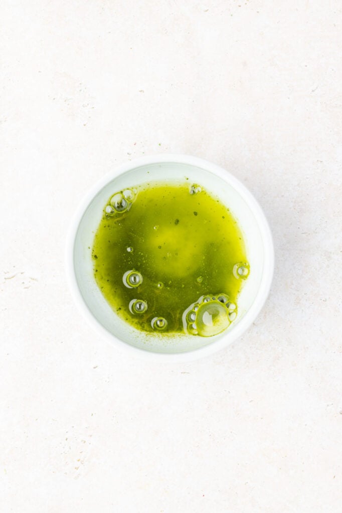 Matcha and water in a bowl