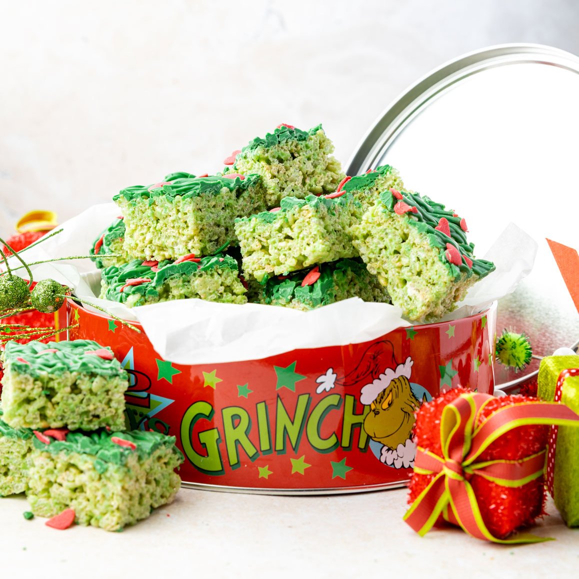 Grinch rice crispy treats in a metal tin