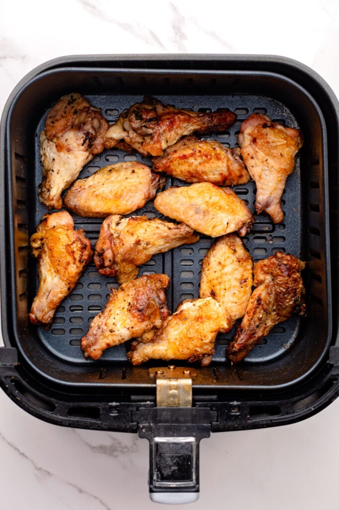 Cooked chicken wings in a air fryer.