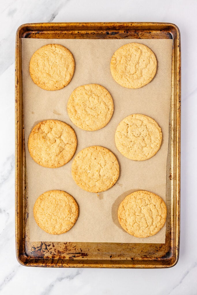 Finished baked chocolate chipless cookies on a sheet pan with parchment paper