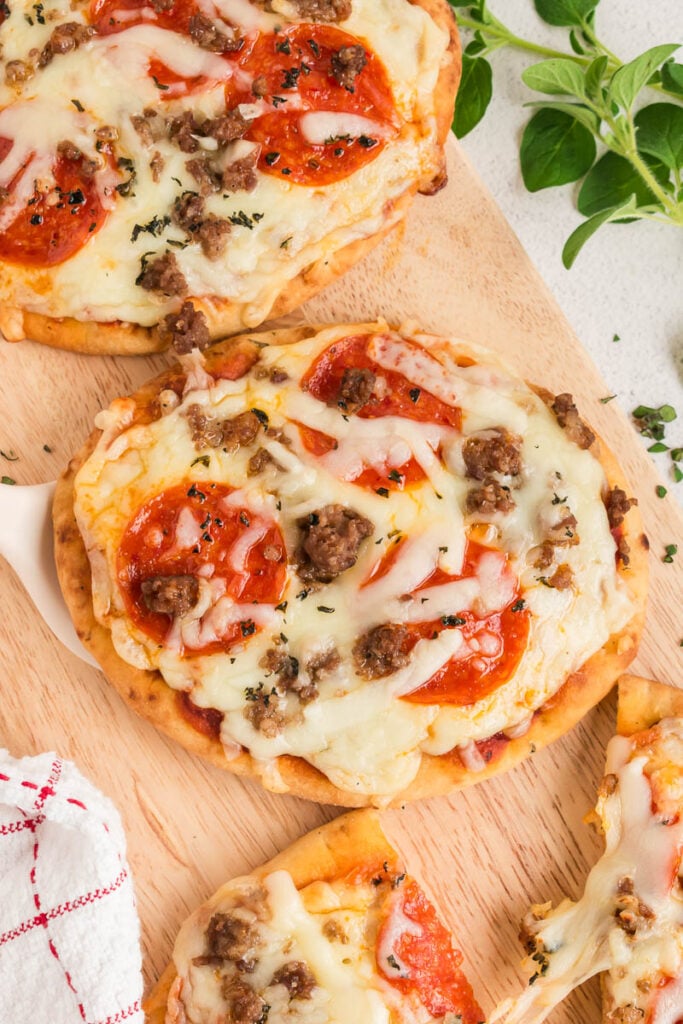 naan flatbread pizza on a cutting board