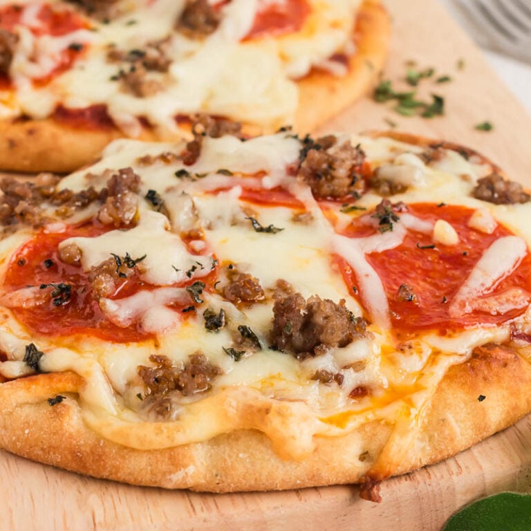 naan flatbread pizza on a cutting board