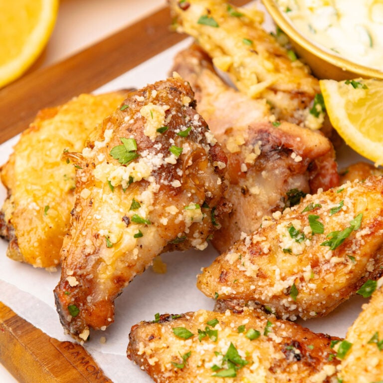 Air Fryer Garlic Parmesan Wings on a cutting board