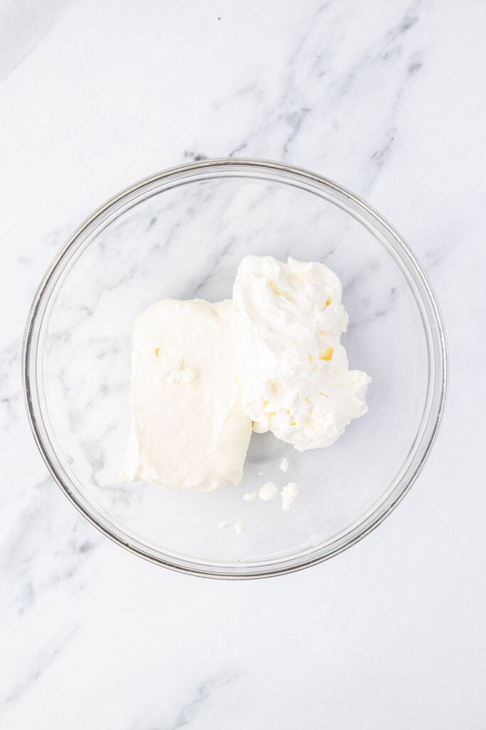 Cream cheese and sour cream and a mixing ball