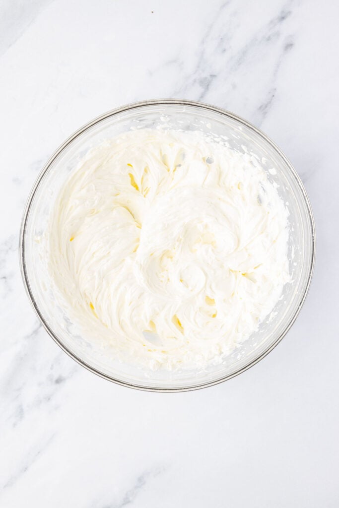 Whipped cream cheese in a mixing bowl