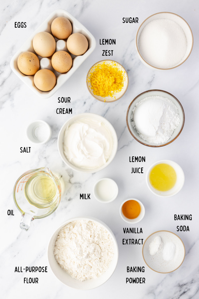 All the ingredients for a lemon loaf in small mixing bowls