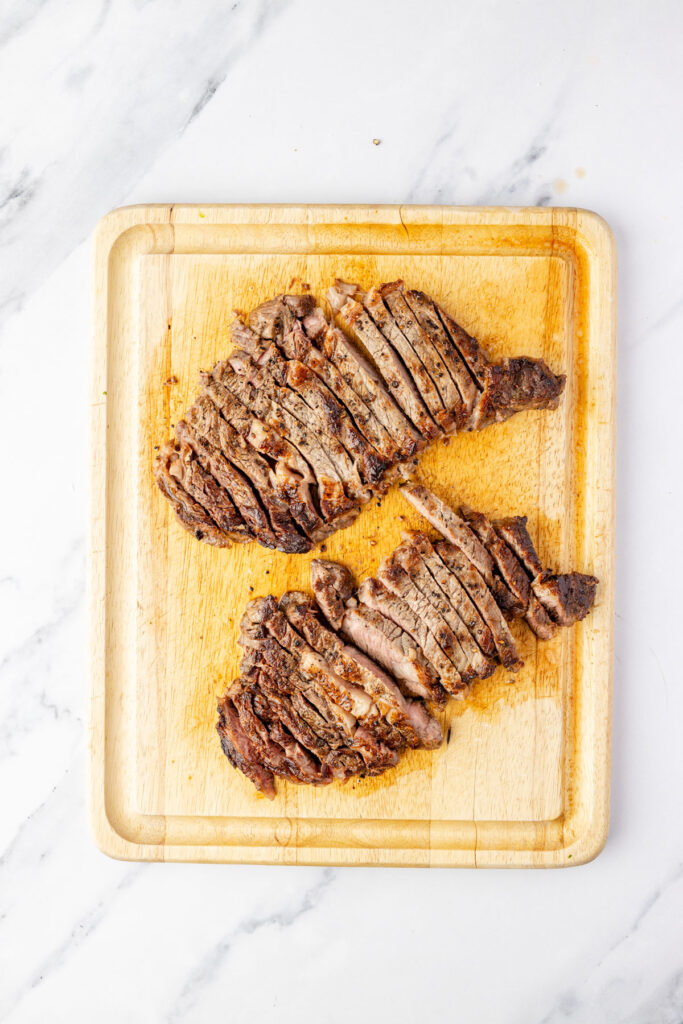 Cooked steak on a cutting board