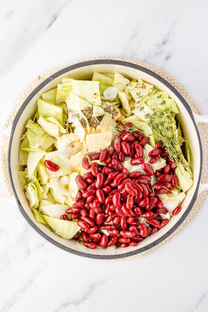 Cabbage, beans, spices in a pot