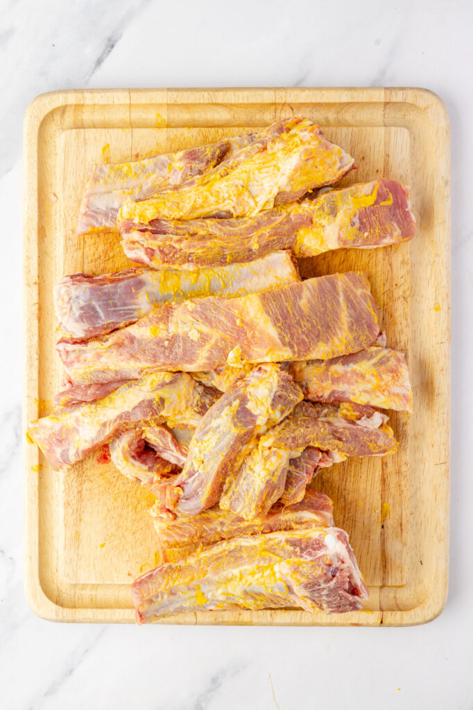 mustard rubbed ribs on a cutting