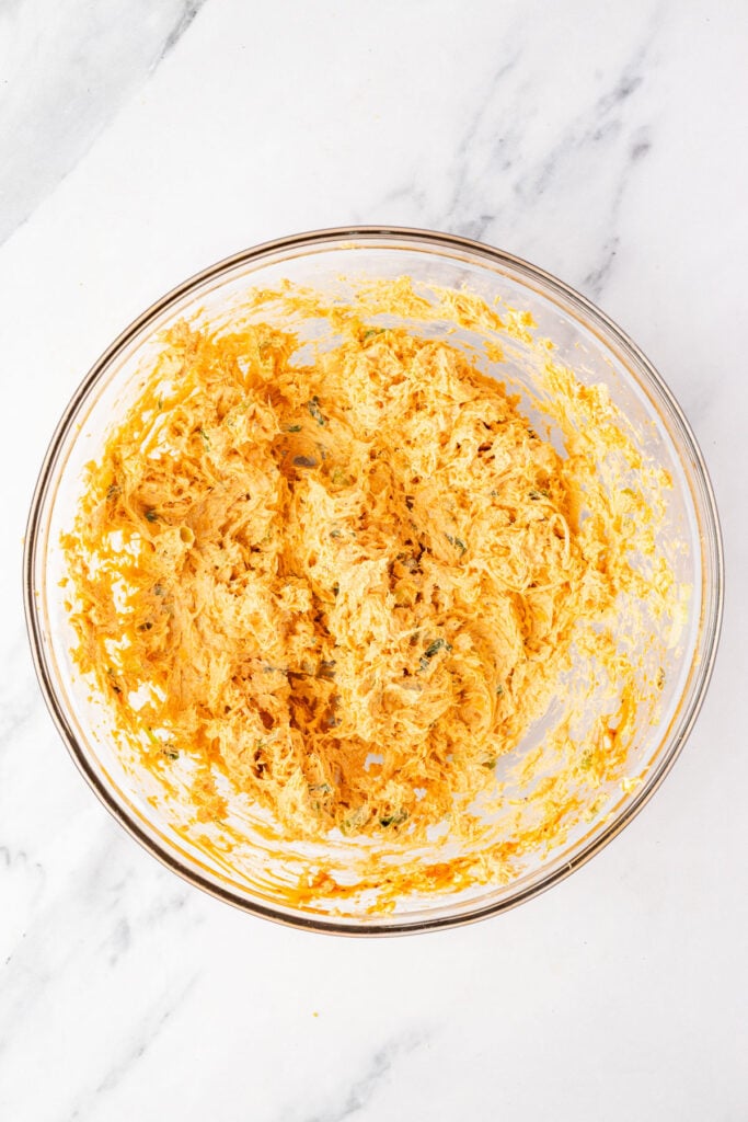 Buffalo chicken filling in a mixing bowl
