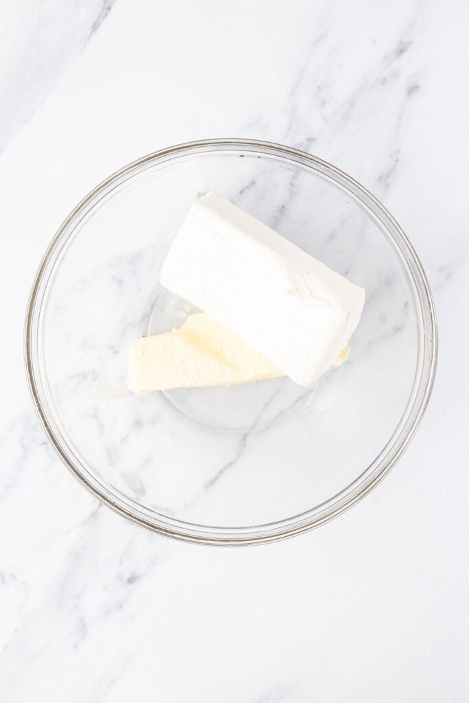Cream cheese and butter in a mixing bowl