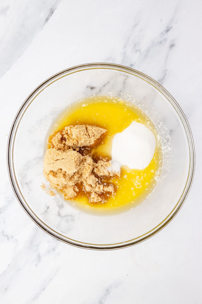 butter, brown sugar, and sugar in a mixing bowl