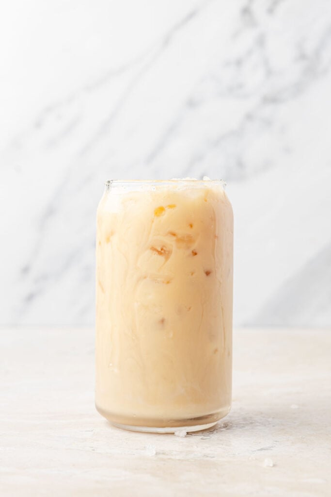 Finished iced chai latte in a cup