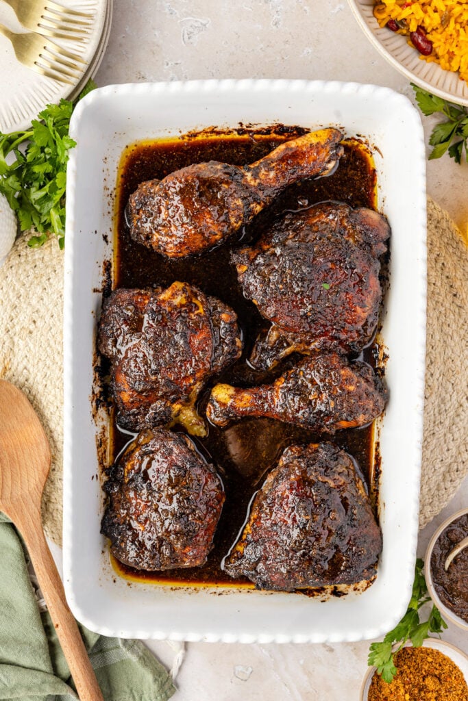 Close-up of baked jerk chicken in a casserole pan