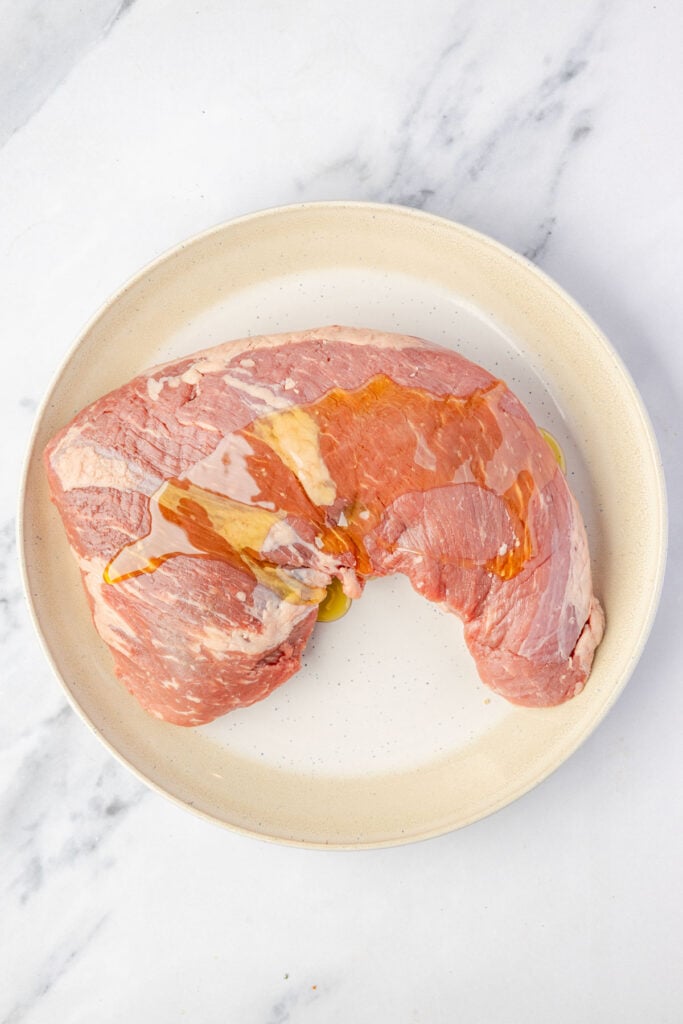 Tri-tip on a plate with oil