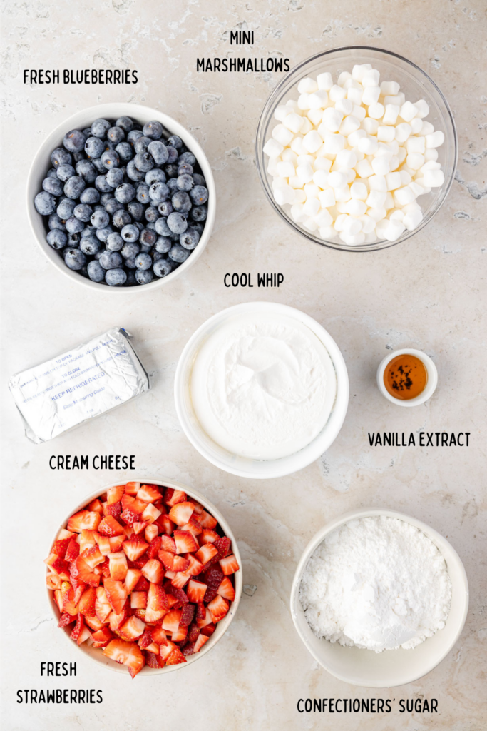 Red White & Blue Cheesecake Salad ingredients in individual bowls