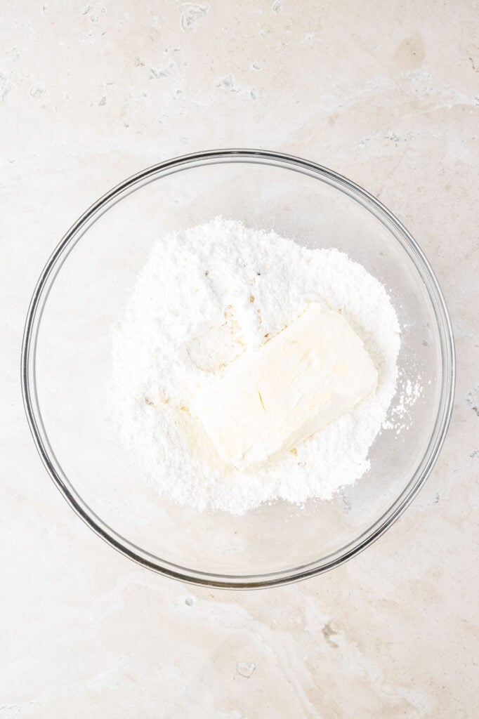 Cream cheese and powdered sugar in a mixing bowl