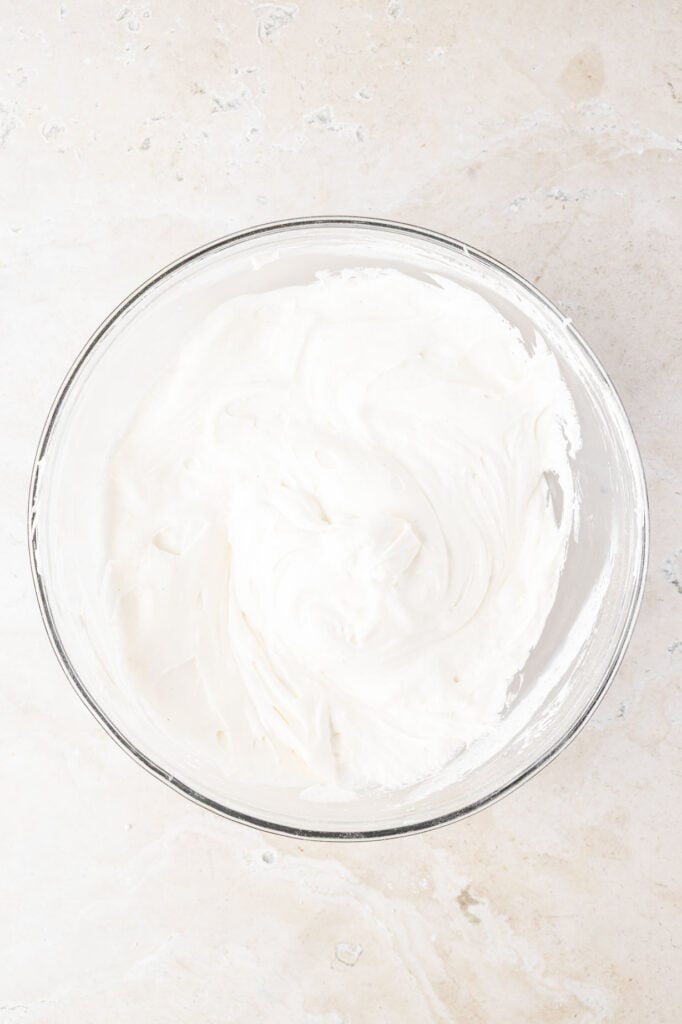 Cream cheese, powdered sugar, and cool mixed together in a mixing bowl