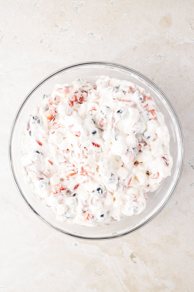 Finished Red White & Blue Cheesecake Salad in a mixing bowl