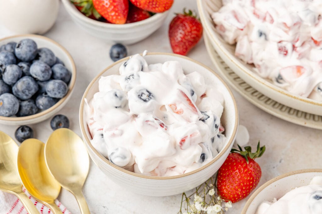 Individual serving size bowl of Red White & Blue Cheesecake Salad