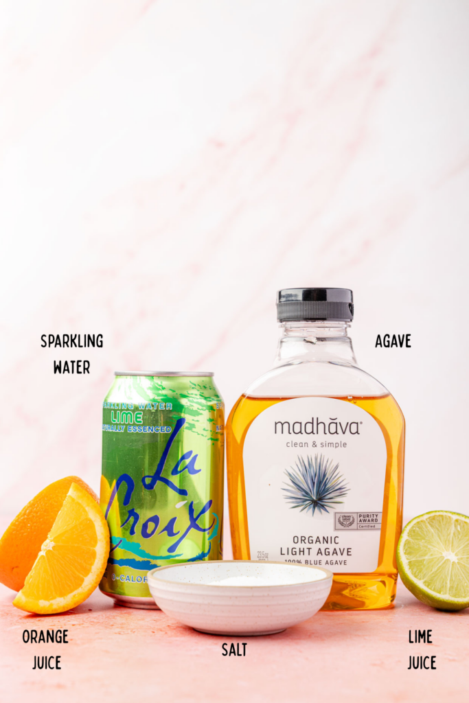 Ingredients for Virgin Margarita (Margarita Mocktail) on a pink background